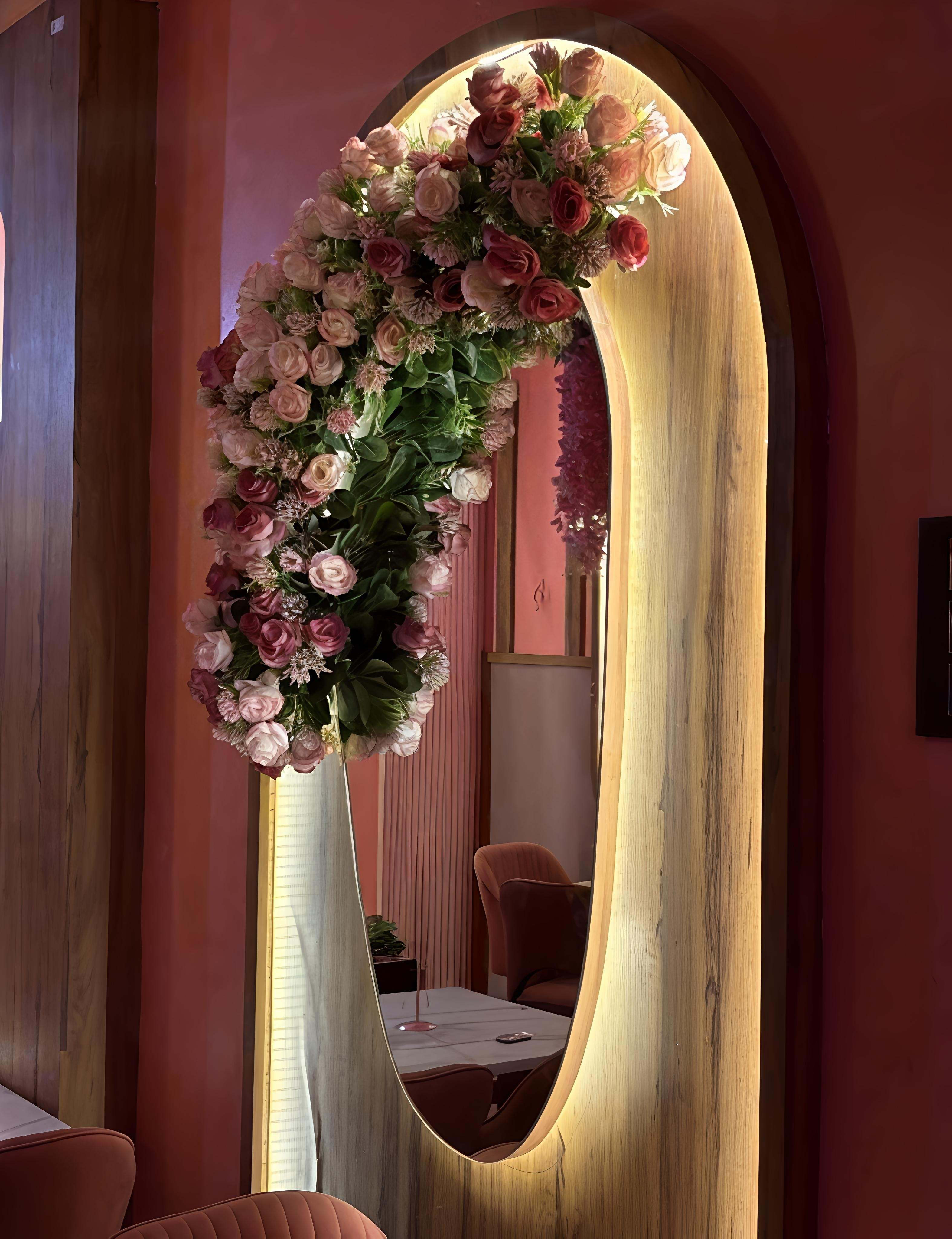 Pink dining hall with custom lighting arches