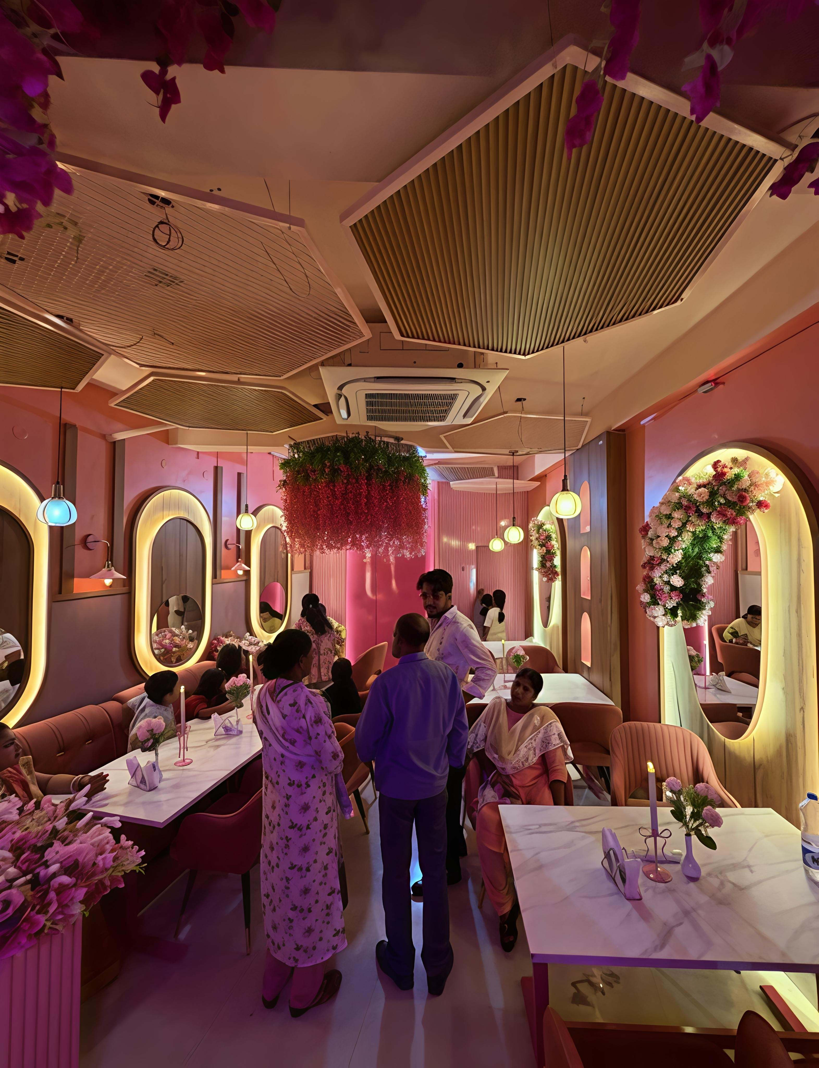 Warm lantern light against pink panels